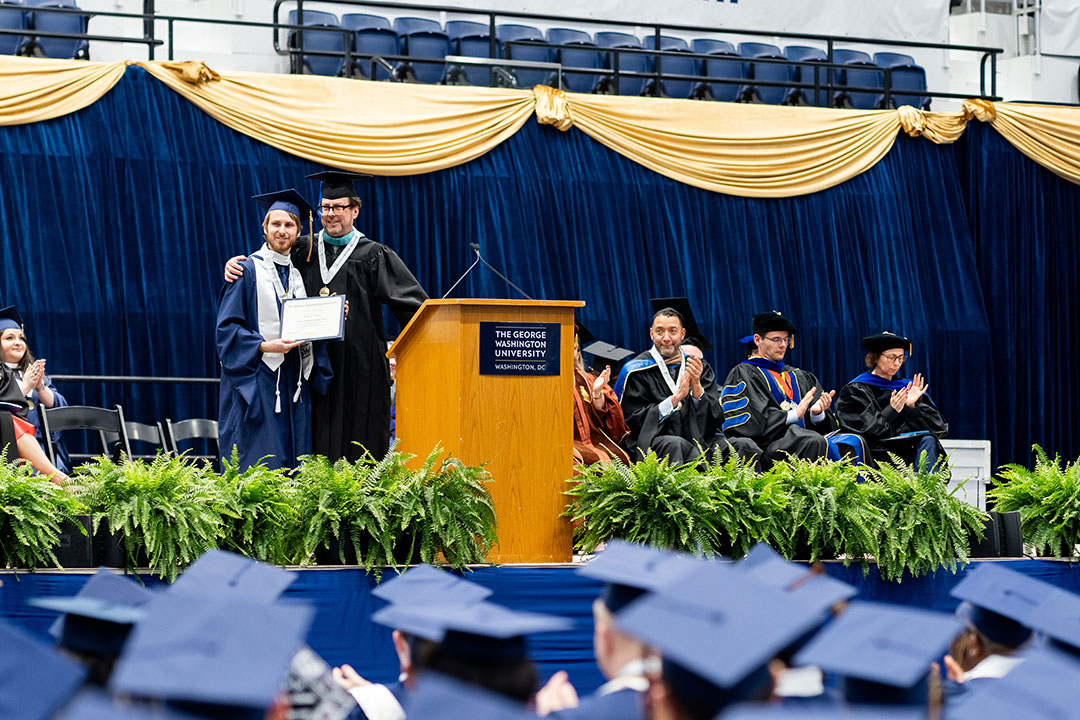 Casey Aimer presented award at commencement